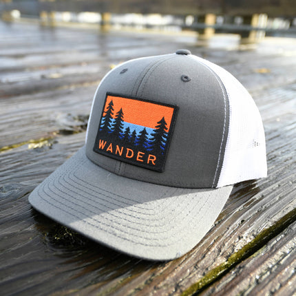 WANDER PATCH CURVED BILL TRUCKER HAT